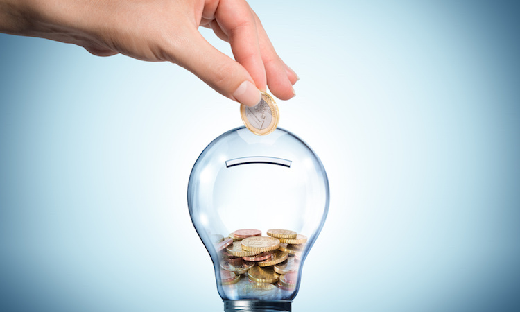 invest to energy concept - euro in bulb - piggybank